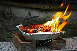 A disposable barbecue, commonly available in supermarkets in the U.K.