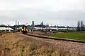 A Class 153 operated by Abellio Greater Anglia leaving Ely Dock Junction on a service to Ipswich with the ex-GER mainline in the background and Ely Cathedral on the skyline