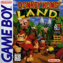 Donkey Kong, a brown gorilla wearing a tie, and Diddy Kong, a brown monkey wearing a red vest and cap, walk through the jungle towards the viewer. Above them are two flying pigs and a wasp, aside them a mole wearing a hard hat, and behind them a muscular crocodile. The words "DONKEY KONG LAND" appear above, and on the left side the "GAME BOY" banner appears from top to bottom.