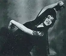 Doris Niles, smiling in a Spanish dance pose, from a 1922 issue of Broadway Brevities