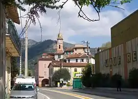 The church and the village, seen from the road