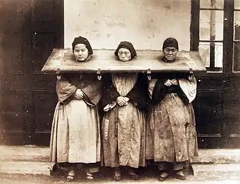 Three women in the pillory, China, 1875