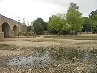 The River Wharfe at Wetherby, West Yorkshire by Wetherby Bridge having largely dried up