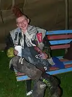 A street punk wearing self-bleached denim vest of the type commonly seen during the early 1980s.