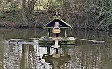 "Duckingham Palace" duck house on Widmore Pond, Sonning Common, UK.