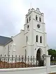 Typical Neo-Gothic cruciform church with decorative corner buttresses.
Square bell tower at entrance.
This imposing church, the nave of which was consecrated in 1864, was enlarged in 1910 by the addition of two wings, the vestibule and the stately tower.
Type of site: Church
Current use: Church : Dutch Reformed.
Fine example of ecclesiastical building providing an architectural landmark in the village.
Historically and culturally significant in the village history.