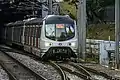 MTR Metro Cammell EMU (AC) exiting the Beacon Hill Tunnel and arriving at Kowloon Tong Station