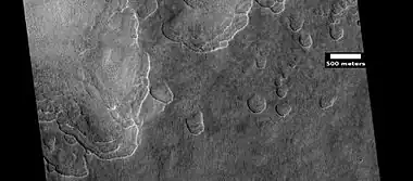 Scalloped ground, as seen by HiRISE under HiWish program.