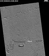 Lava flows affected by obstacles, as seen by HiRISE under HiWish program  Arrows show two obstacles that are changing the flow.