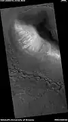 Wide view of upper plains unit eroding into hollows, as seen by HiRISE under HiWish program  Parts of this image are enlarged in following images.