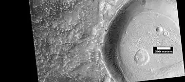 Wide view of ring-mold craters on floor of larger crater, as seen by HiRISE under HiWish program