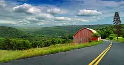 Pennsylvania Route 154 as it passes through the township with the Allegheny Plateau in the background