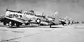 North American AT-6C Texan trainers on flight line.