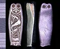 Anglo-Saxon silver strap end in the Trewhiddle style, now only with traces of niello left. 9th century