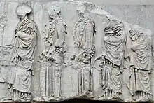 Photograph of part of the Parthenon frieze, showing five girls in profile.