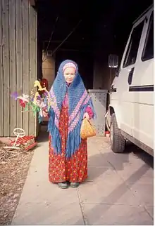 Easter witch handing out gifts (tree twigs) in Finland in 1998. The small basket is for thank you gifts.