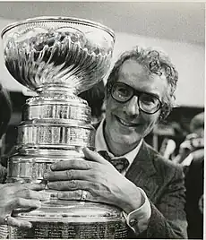 Ed Snider smiles alongside the Stanley Cup after the Flyers won the league's title in 1974