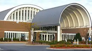 Eden Prairie Library, a brick building with a huge semicircular gray metal covering over its entryway, pictured in 2011