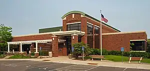 Edina Library, a brick building with an arched entryway and a rectangular concrete pavilion over the entrance