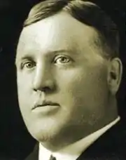 Black and white photo of a man in a suit and tie