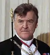 Clean-shaven elderly man in court uniform at UK Opening of Parliament, 2000