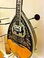 Modern bouzouki with inlaid rosette and scratch plate.