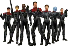 Seven characters wearing armored versions of the Star Trek: Voyager uniforms and carrying a variety of futuristic weaponry. Among their number are two women and a blue-skinned alien.