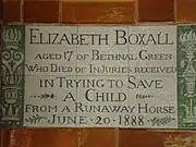 A tablet formed of six standard sized tiles, bordered by green flowers in the style of the Arts and Crafts movement