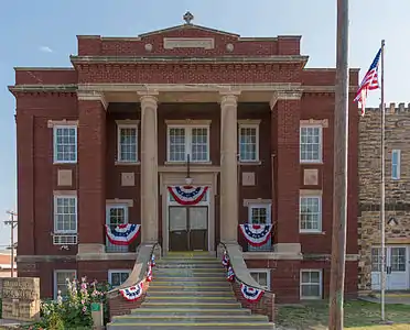 Photo of building next to the historic stone church