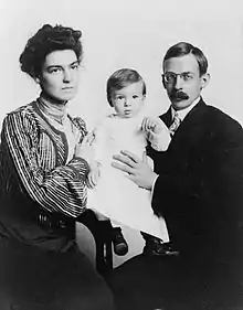 American boy, 1902.  One-year-old Melville Bell Grosvenor is held by his parents, Elsie May Bell and Gilbert H. Grosvenor