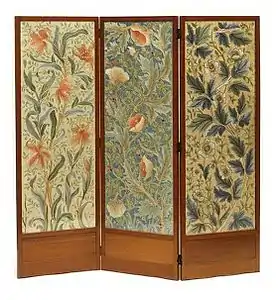 Embroidered screen by John Henry Dearle (1910), with panels of canvas embroidered with silks in darning, stem and satin stitch. The screens represent the 'Parrot Tulip', 'Large Horned Poppy' and 'Anemone' designs. (Victoria and Albert Museum)