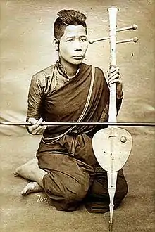 Cambodian musician playing a tro Khmer