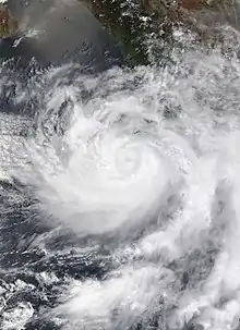 Hurricane Enrique on June 27 off the western coast of Mexico. The storm has a noticeable, but not clear eye, and more of the clouds are located to the southwest of the center.