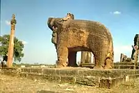 The body of the stone boar statue has carvings of sages and scholars.