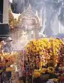 Flowers and incense around the shrine.