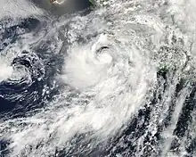 A visible satellite image of a disorganized and large hurricane just offshore southwestern Mexico on July 6.