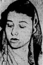 A newspaper photo of a woman with dark hair, looking downward and to her right.