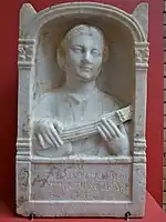 Memorial stele for a 16-year-old Roman woman, shown playing a pandurium, 2nd century AD, from Emerita Augusta, Hispania (Museo Nacional de Arte Romano, Mérida, Spain)