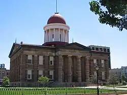 Color photo shows a domed building.