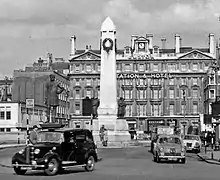 Obelisk with classical frontage in background