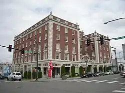 A five-story brick building with hotel-style windows.