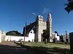 Front of a big-sized Baroque church and its complex in part.