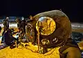 The Soyuz return capsule on the ground after a rare night landing.