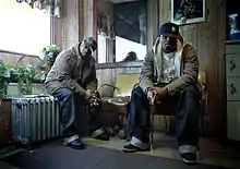 Portrait of Frank N' Dank at Frank's Barber Shop in Brooklyn, New York.