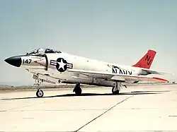 Navy fighter jet parked on a tarmac