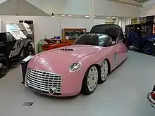 A streamlined six-wheeled car