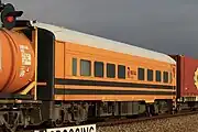 Crew car FDDY 2 (former Bluebird railcar 104 ‘Avocet’) on an Aurizon intermodal train at Virginia, September 2022.