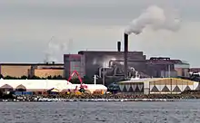 White bags filled with contaminated stones line the shore near an industrial oil spill in Raahe, Finland