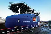 Proteus in dry-dock at Cammell Laird, Birkenhead in 2023, with its previous name Topaz Tangaroa