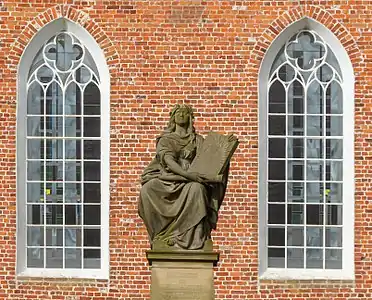 Monument to David and Johannes Fabricus outside the church